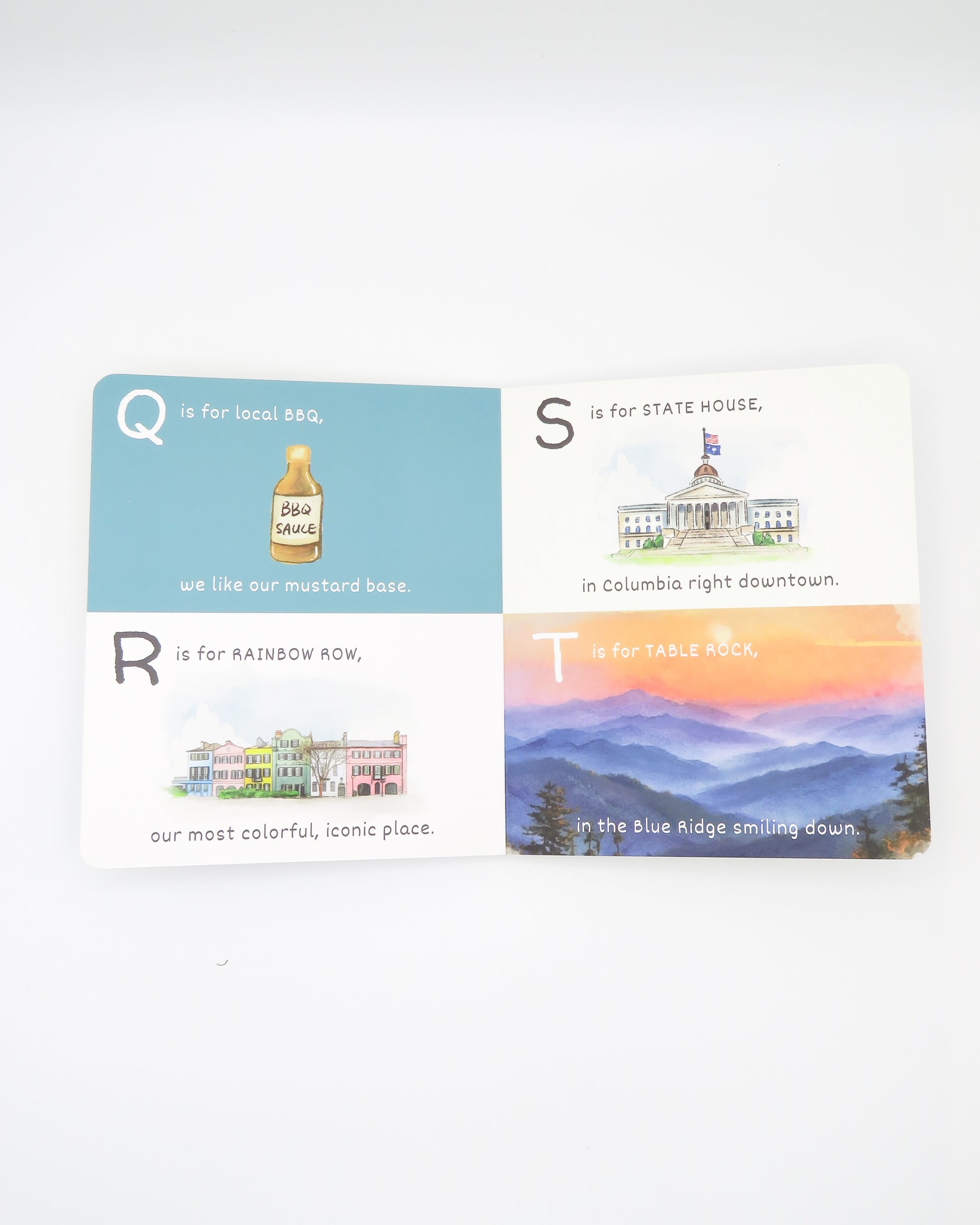 Kids ABC book with scenic illustrations and text on a white background