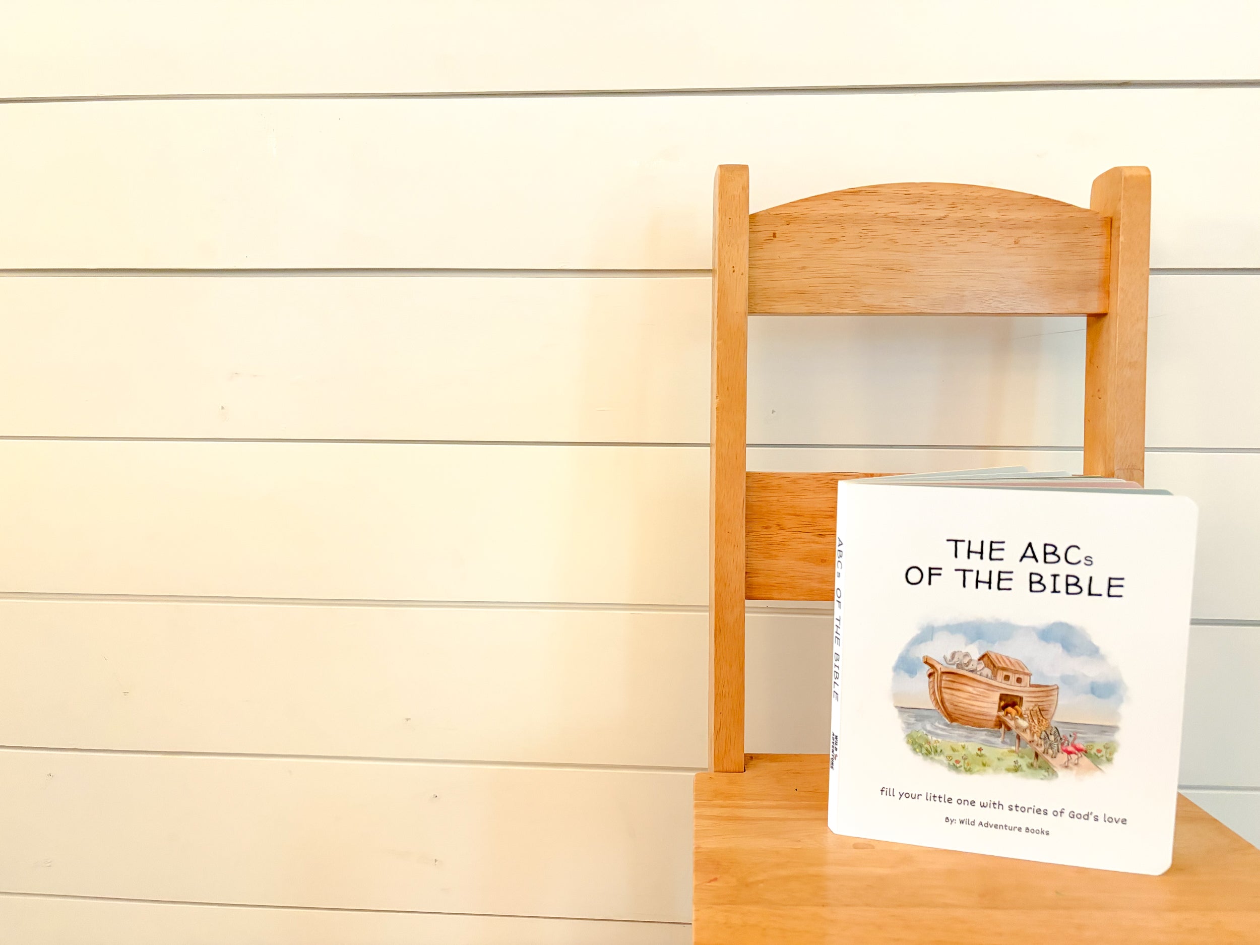 ABCs of the Bible Cover image sitting on chair